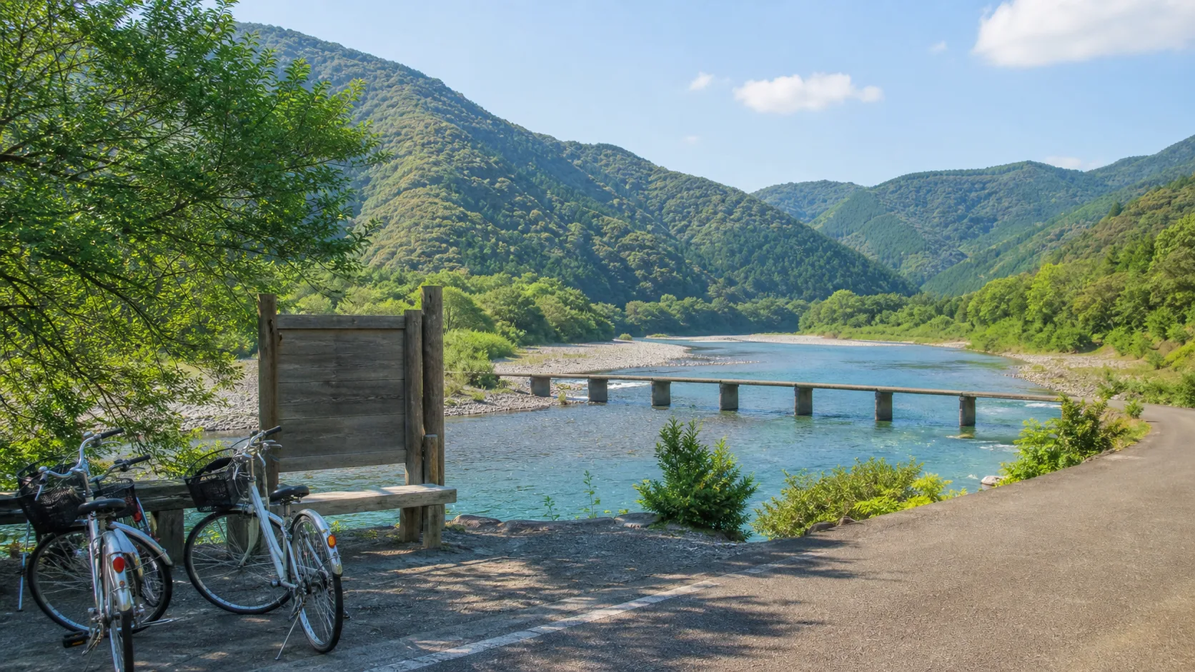 四万十川沿いのサイクリングと沈下橋を表す写真調イメージ